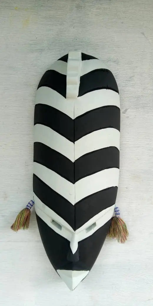 Mama Zuri Style Black white wooden mask décor for a white living room wall