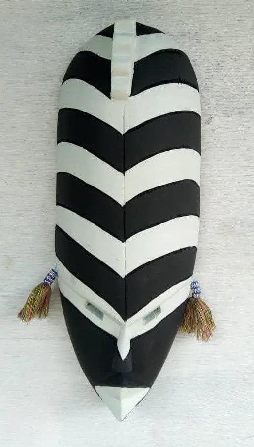 Mama Zuri Style Black white wooden mask décor for a white living room wall